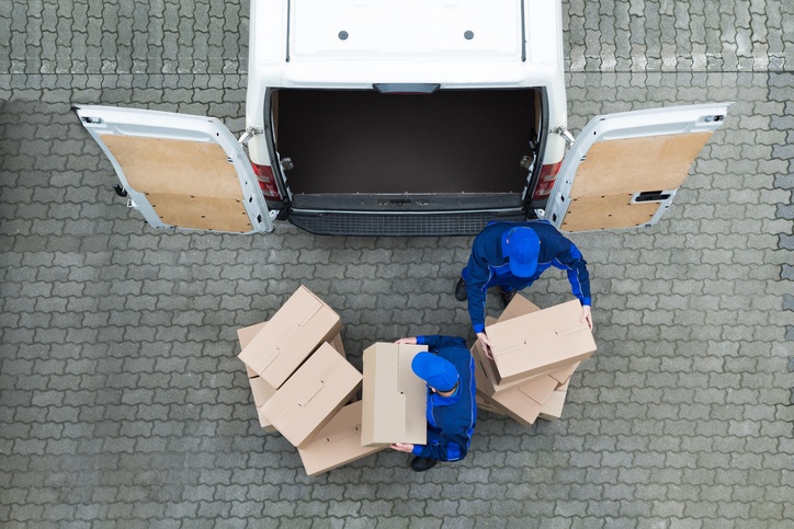 Man loading boxes into a van